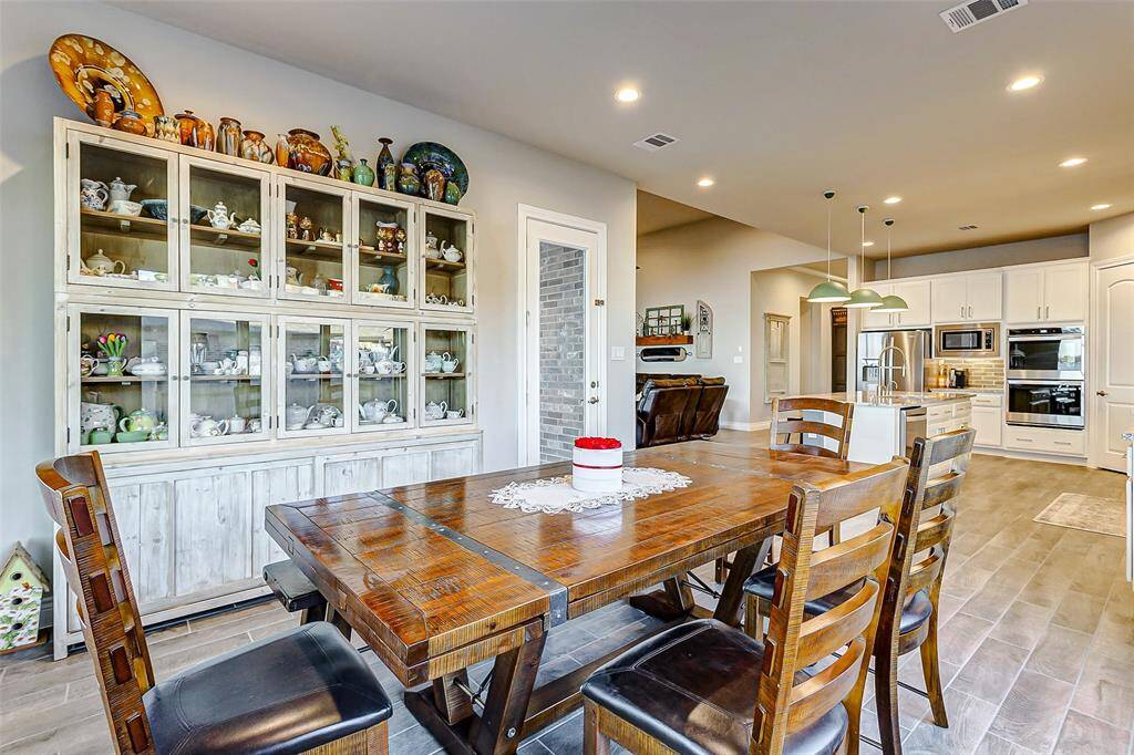 Dining room facing the side yard and backyard complete with motorized shades