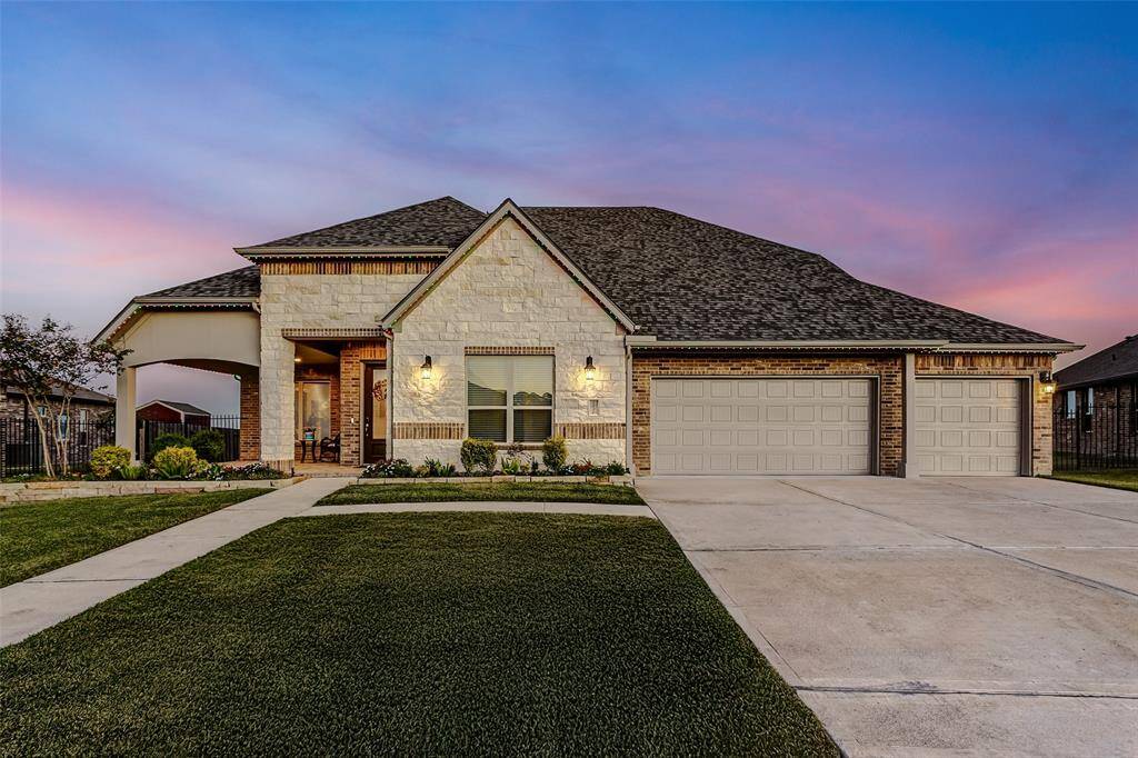 Enjoy a nice sit in porch for outdoor relaxation. This former MODEL home is full of upgrades.