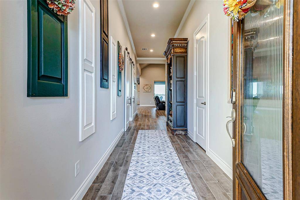 Sleek modern kitchen featuring premium finishes, stainless steel appliances, double oven, and ample counter space for cooking and entertaining