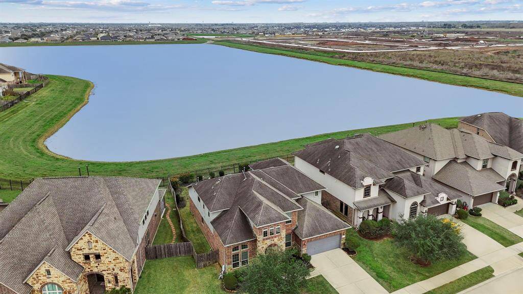 Discover this breathtaking two-story home where the lake is your serene neighbor! Enjoy stunning lake views in the highly sought-after Grand Vista community, known for its prestige and low taxes. Perfectly located just minutes from major highways, this home offers convenience and peace of mind, with no flooding during any storms. Don’t miss out on this incredible opportunity to have a Waterfront Home! No one watching you when you are enjoying that amazing backyard!