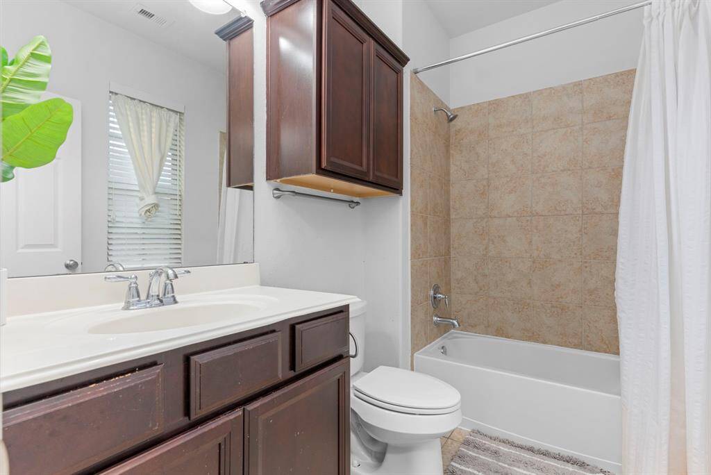 The guest suite features its own private bathroom, complete with a tub and shower combination for added convenience and comfort!