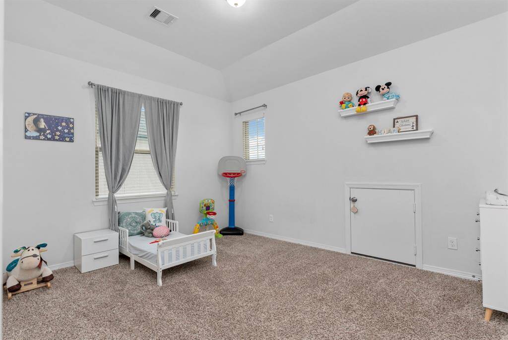 All the guest bedrooms upstairs boast dramatic high ceilings, adding an open and airy feel to each space!