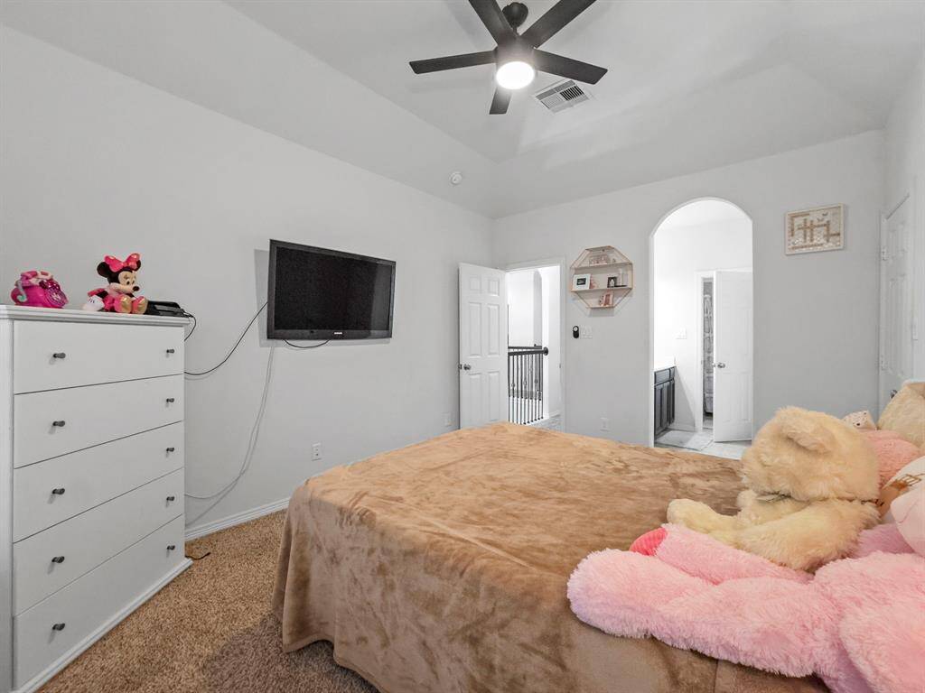 This guest bedroom has its own private vanity area.