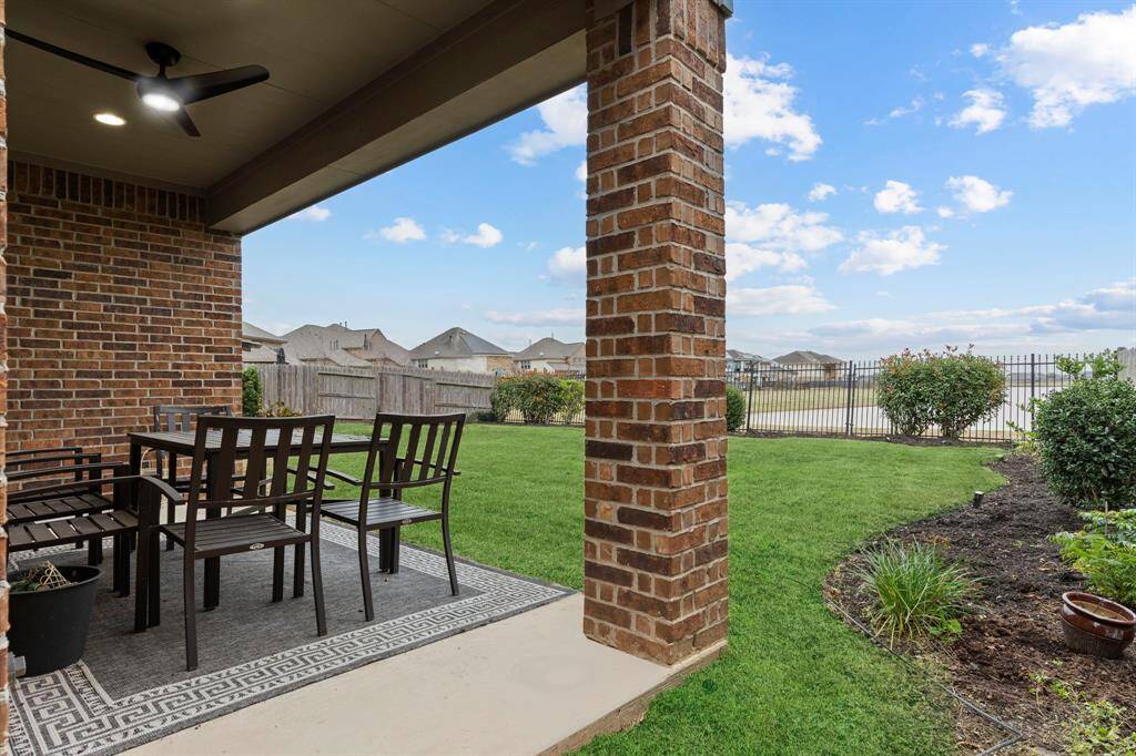 Look out on your large, covered patio looking out to the lake! Great Lake Lot!