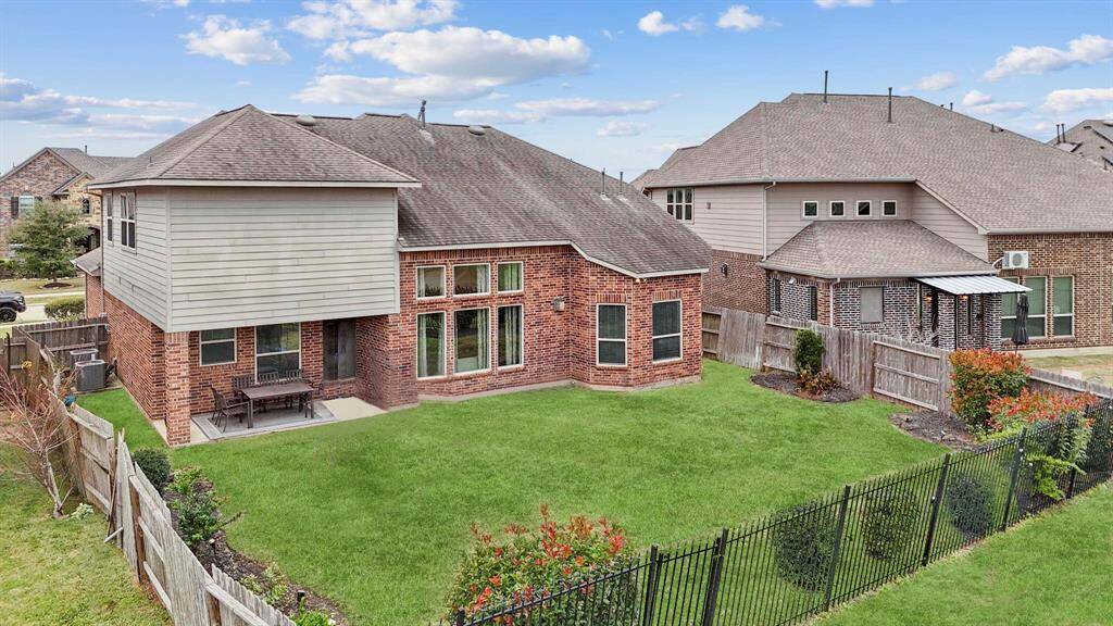 Enjoy endless outdoor fun on this spacious, covered patio—perfect for gatherings, relaxing, or simply soaking up the fresh air! The beautifully landscaped yard also features a full sprinkler system to keep everything lush and green with minimal effort.