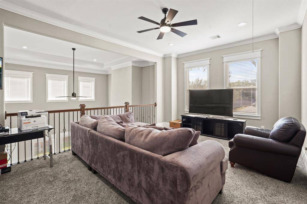 Game room with custom built in wood cabinets