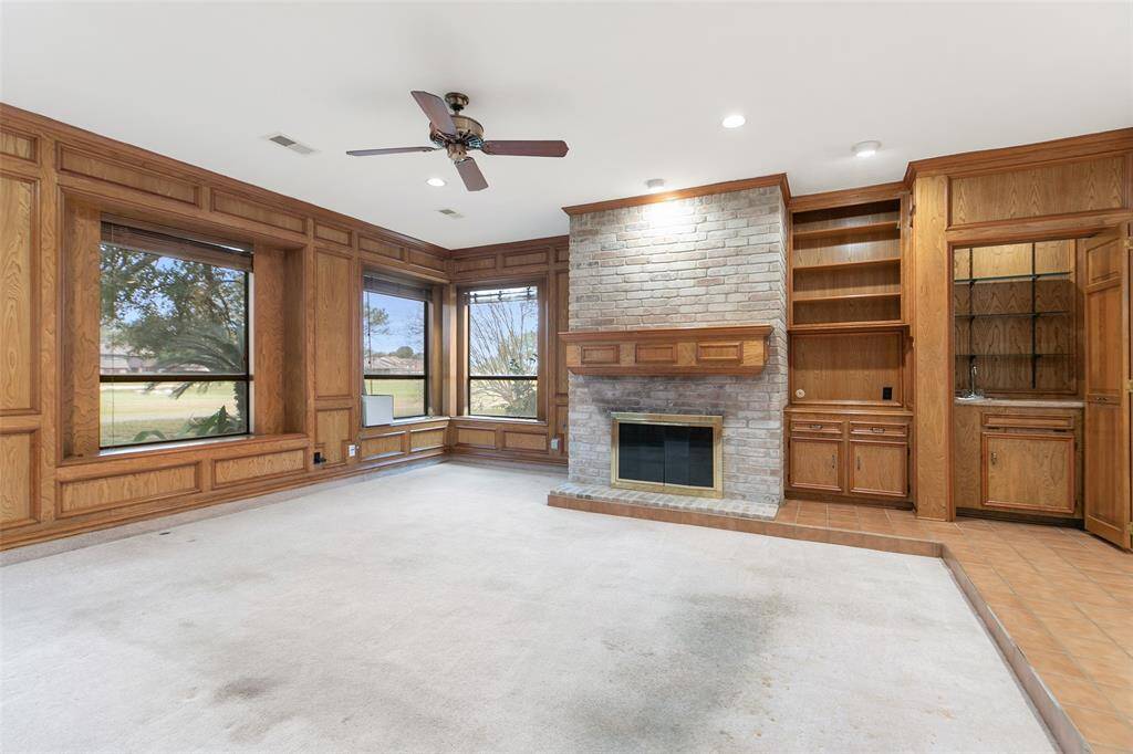 Gas Log Fireplace, Built In Cabinets & Bookcase**Wetbar features Shelving & Cabinet