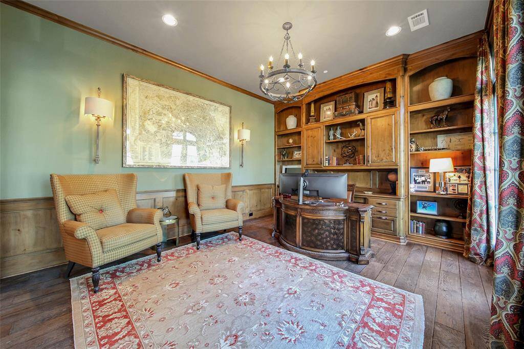 Dedicated office space with ample built-in storage and gorgeous windows.