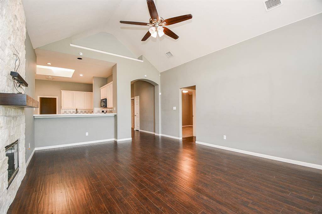 Large family room with wood floors.