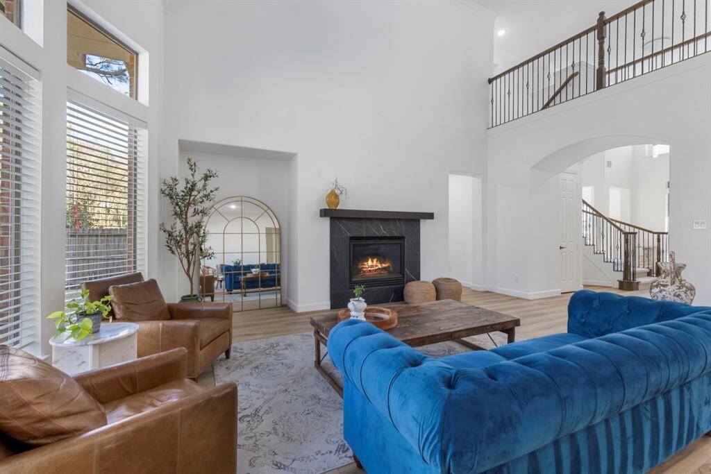 Step into this stunning living space where contemporary elegance meets comfort. The soaring ceilings and expansive windows create a sun-drenched haven, perfect for both entertaining guests and stealing serene moments alone.