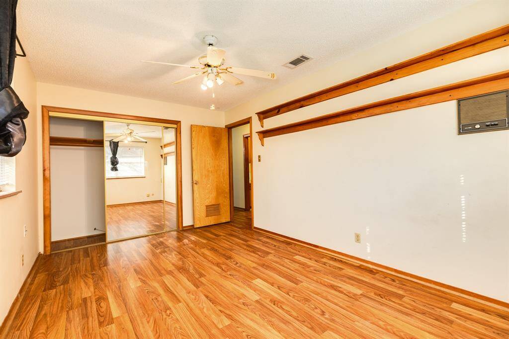 bedroom 1 showing glass closet slider