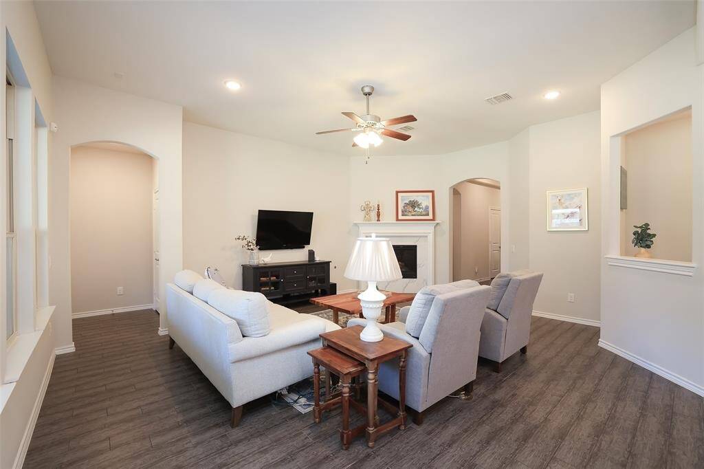 Split plan with primary bedroom hallway at the back of the home