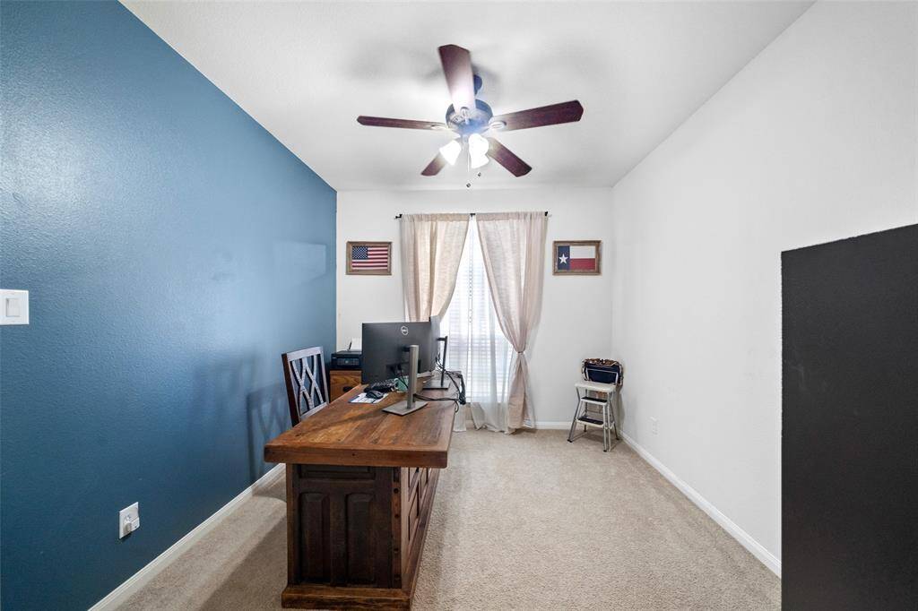 Beautiful primary suite with large windows and carpeted floors!