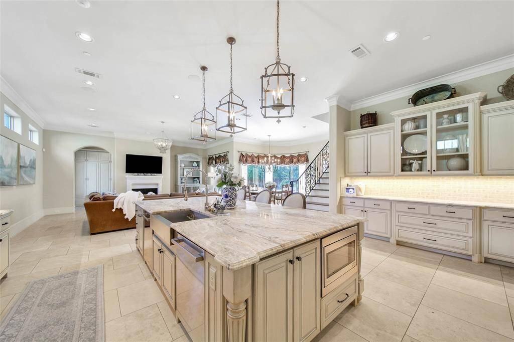 Expansive kitchen with wolf range, spacious island, and ample amount of storage for all of your cooking essentials.