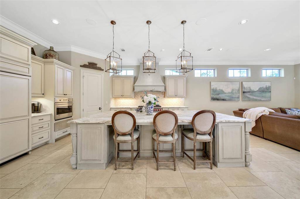 Expansive kitchen with wolf range, spacious island, and ample amount of storage for all of your cooking essentials.