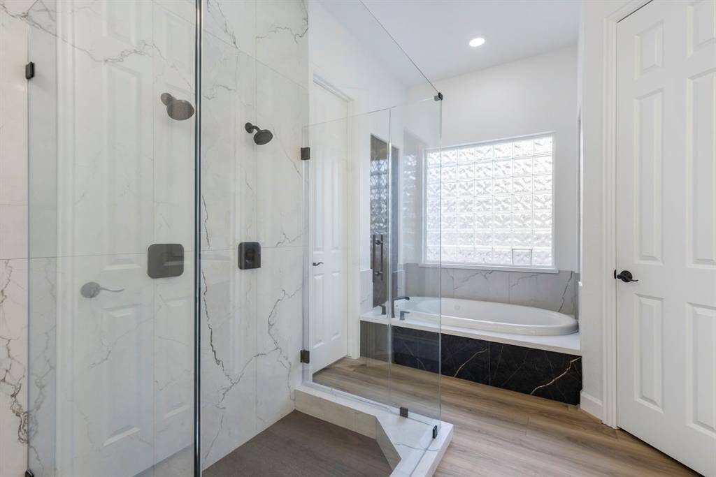 This freshly renovated primary bathroom, features a spacious walk-in shower and a sunlit soaking tub, it’s your very own spa experience without the membership fees.