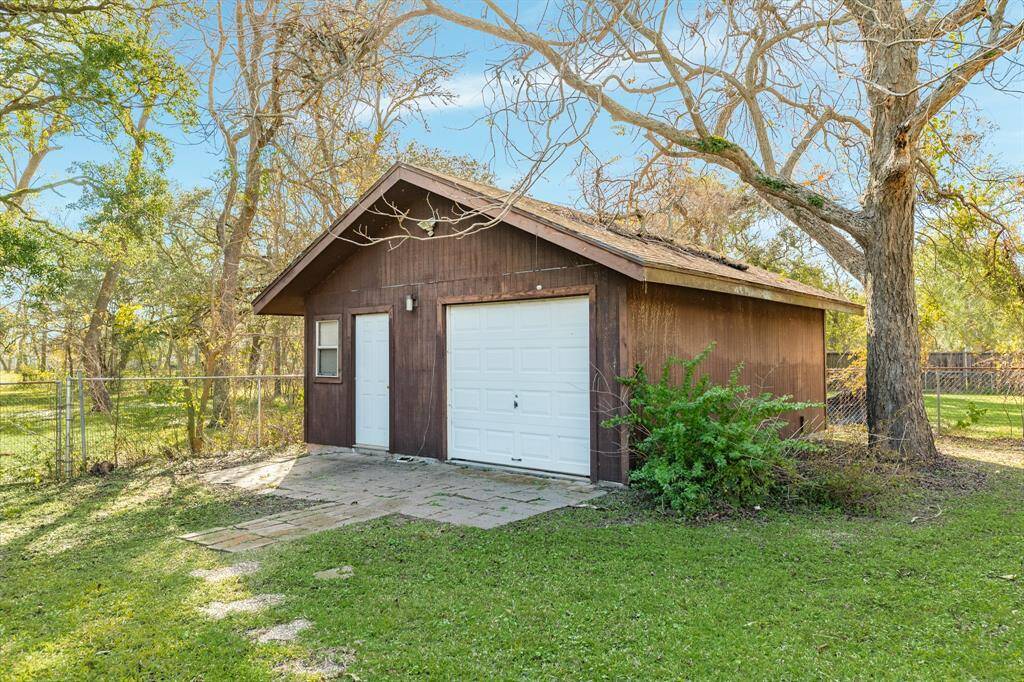 Storage garage in back with stepping stones from house