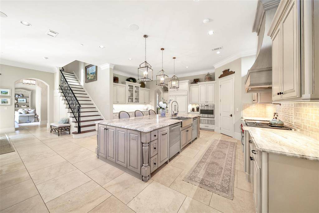 Expansive kitchen with wolf range, spacious island, and ample amount of storage for all of your cooking essentials.