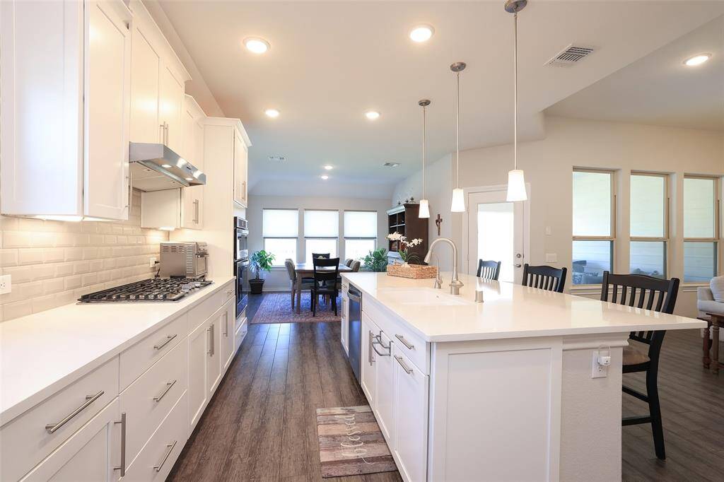 Extra deep sink with window for added brightness to the kitchenAll lower cabinets have pullouts.
