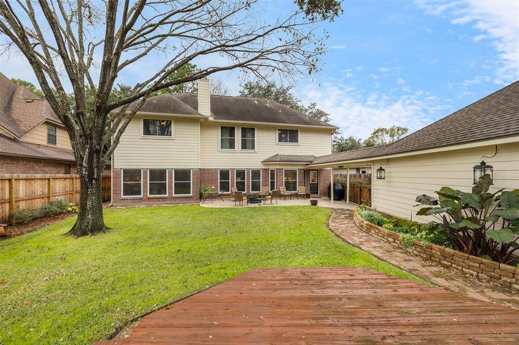 The patio and wooden deck allow for two sitting areas in the back