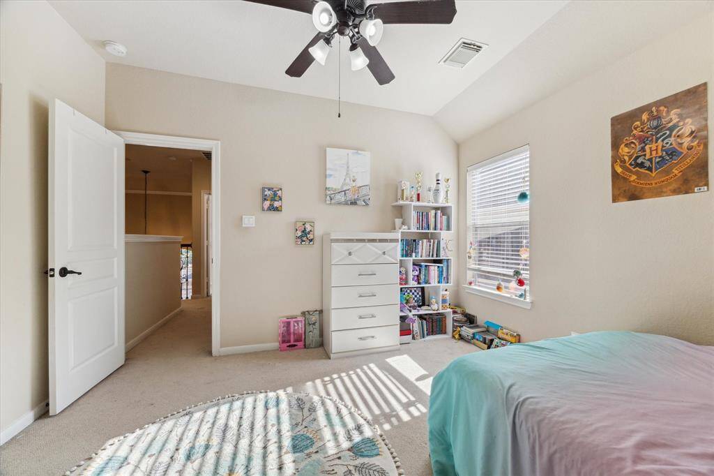 This is a bright, cozy secondary bedroom a walk-in closet located on the second floor