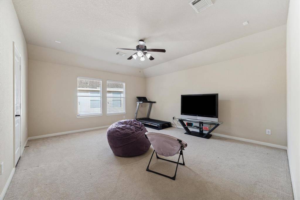 A spacious second floor game room tucked away for extra privacy and functionality