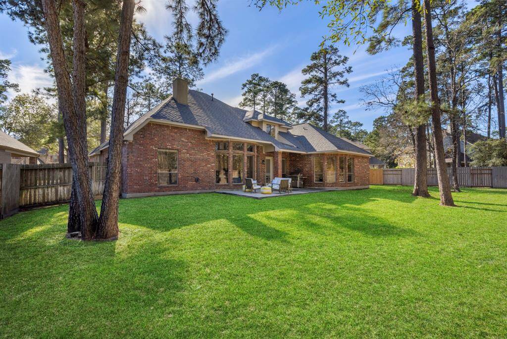 Spacious backyard paradise, perfect for family gatherings and serene evenings under the Texas stars.
