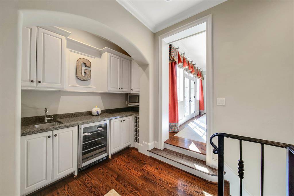 Upstairs wet bar perfectly situated off the game room and theater room.