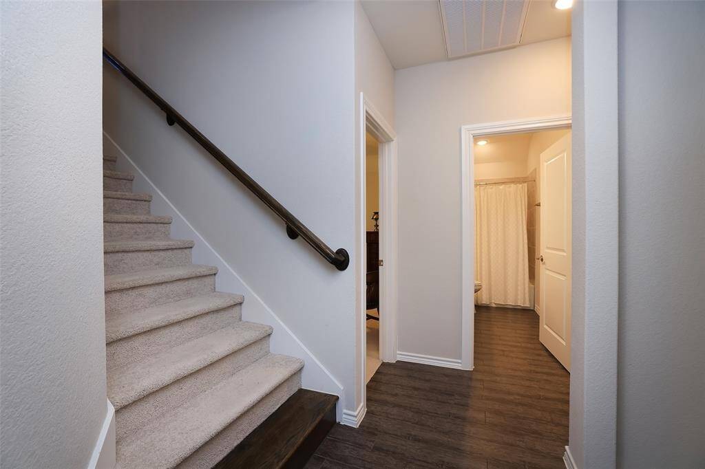 Extra wide staircase with oak wood staircase stained a dark brown