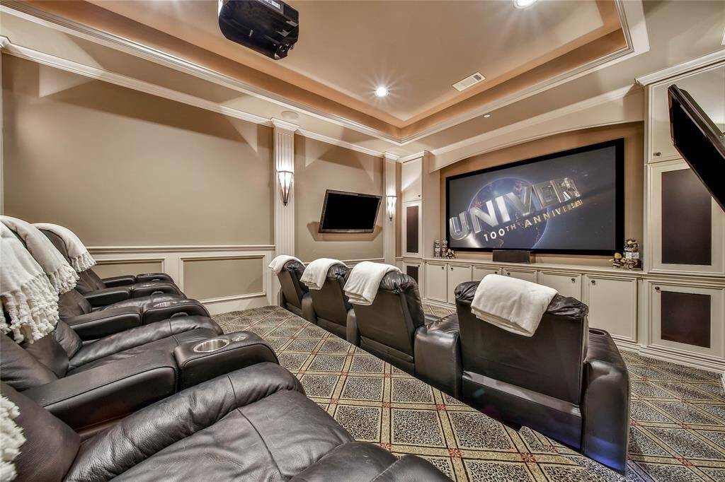 This theater room is an entertainer's dream with comfortable seating for family and friends.