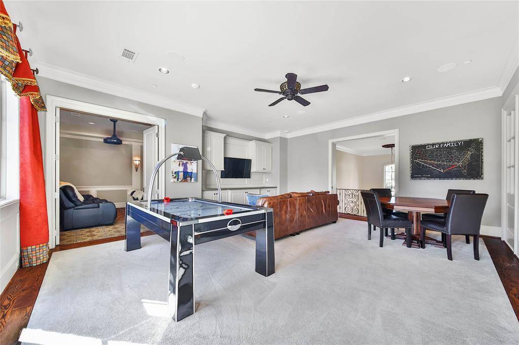 The game room is filled with abundant natural light, perfect for entertainment.