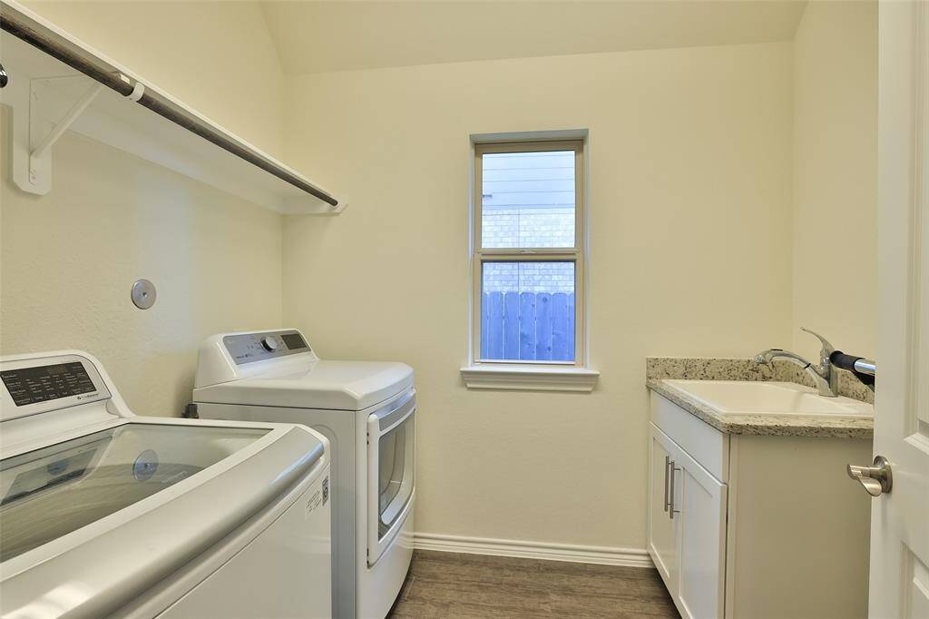Everyone loves a window and a sink in the laundry.. Plenty of hanging space too!