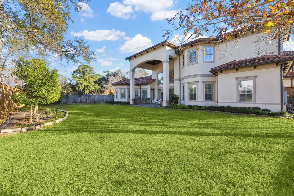 Spacious backyard oasis with lush landscaping and ample room for outdoor activities. Perfect for relaxation and entertaining.