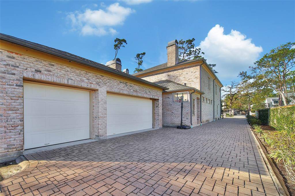 Three car garage with gated private driveway.