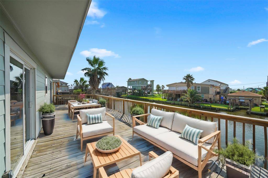 Deep Back porch overlooking the canal - virtually staged