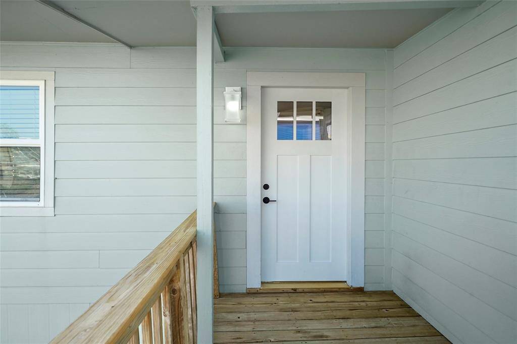 Long covered entry with new front door