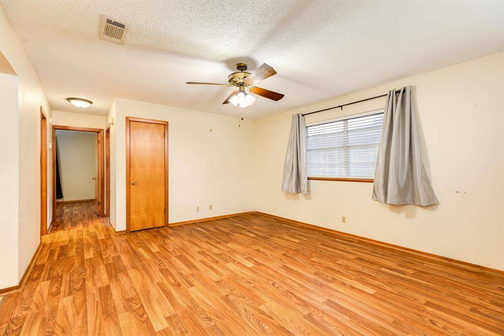 Living area showing hallway to bath and bedrooms
