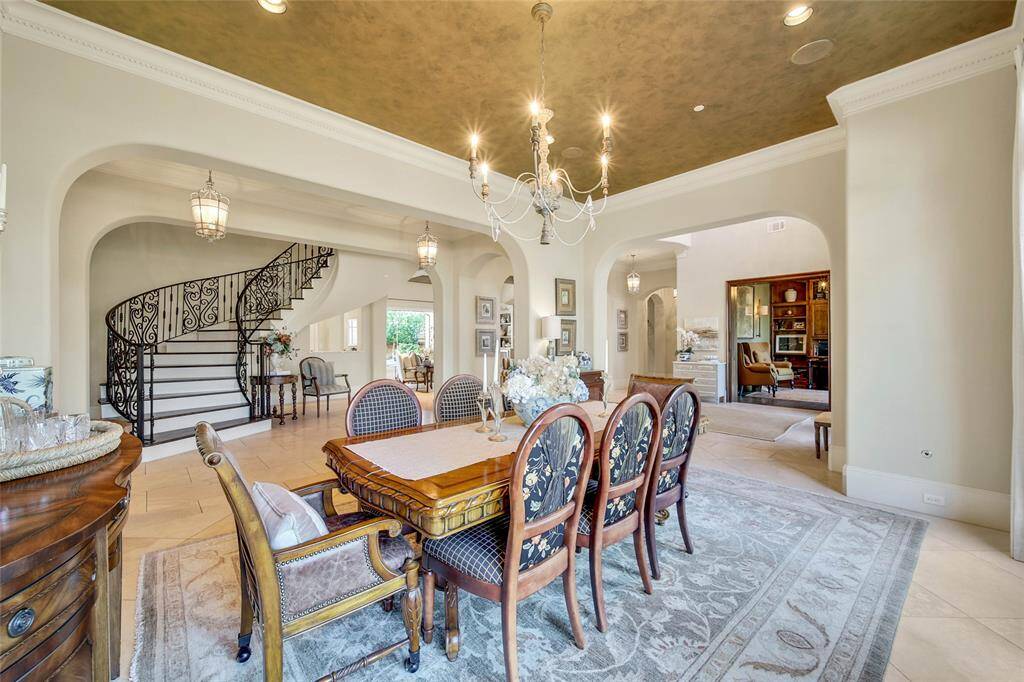 Formal dining space filled with natural light and gorgeous fixtures throughout.
