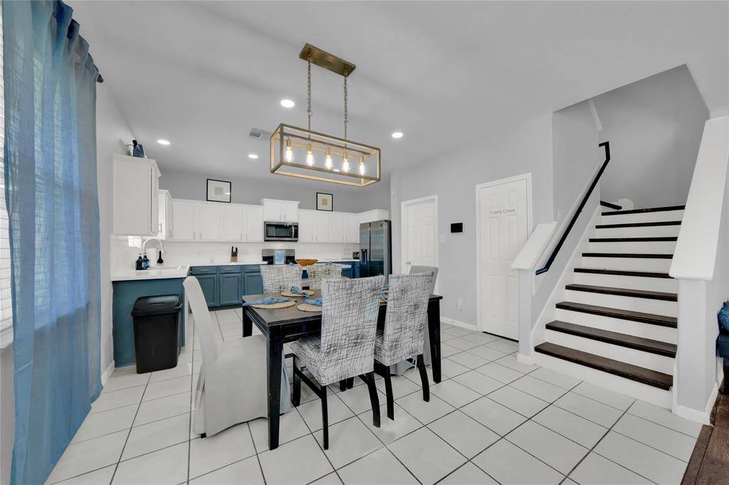 Open to the living area, you will find you and your family dining!