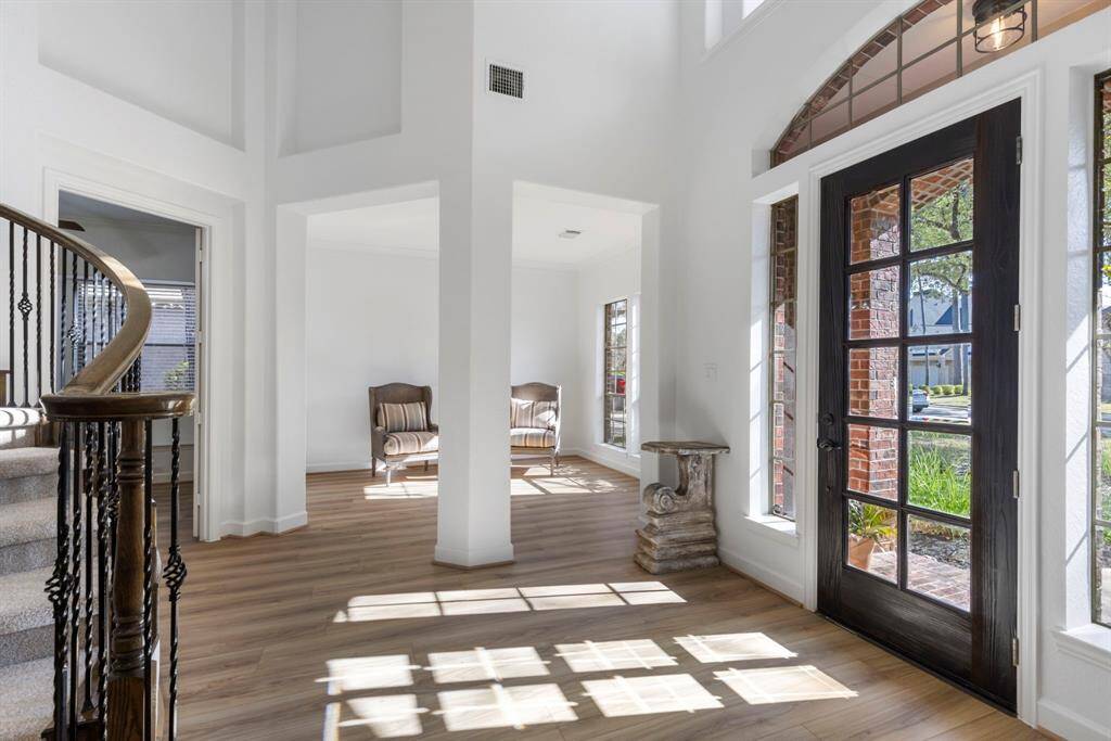 Sunlit elegance welcomes you home with soaring ceilings and charming details.