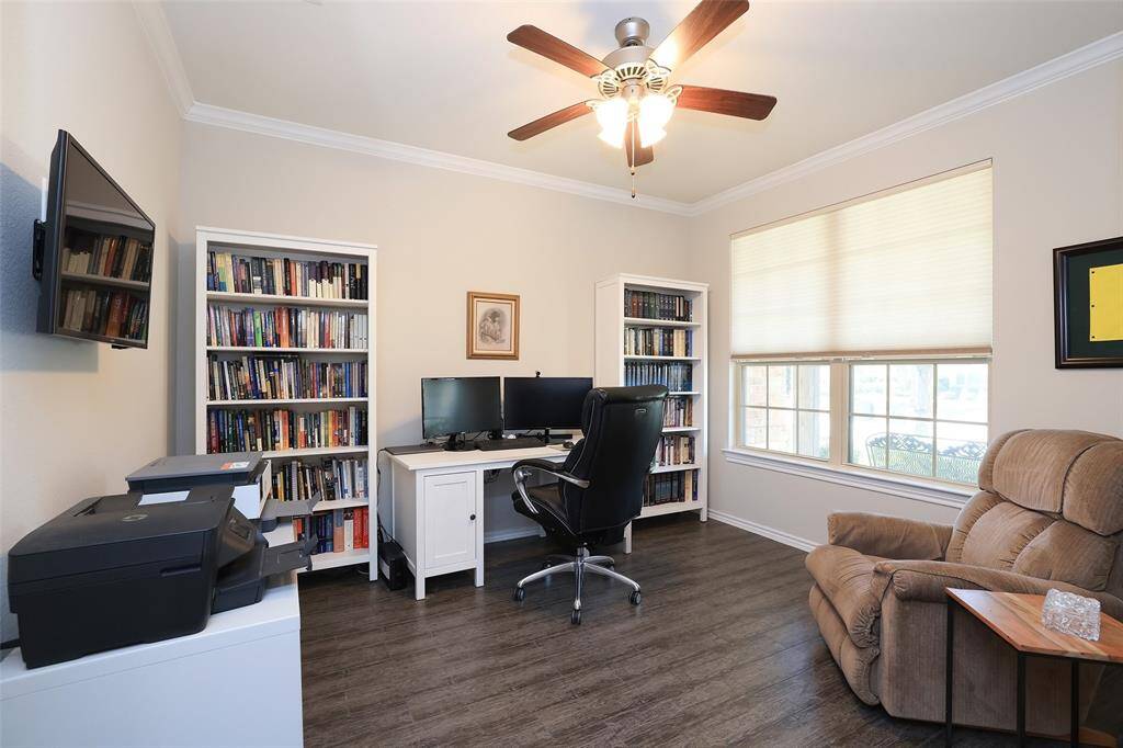 Study features french doors and crown molding