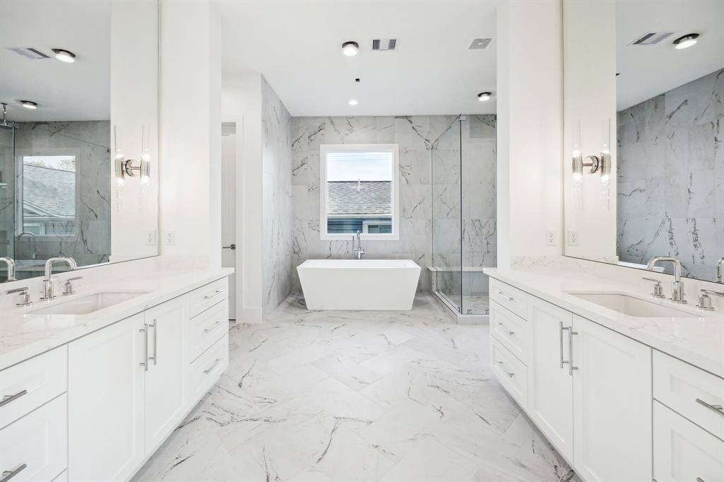 Primary Bathroom with Dual Counters, Free-Standing Tub and a Walk-In Shower.  Construction as of April 18th, 2025.