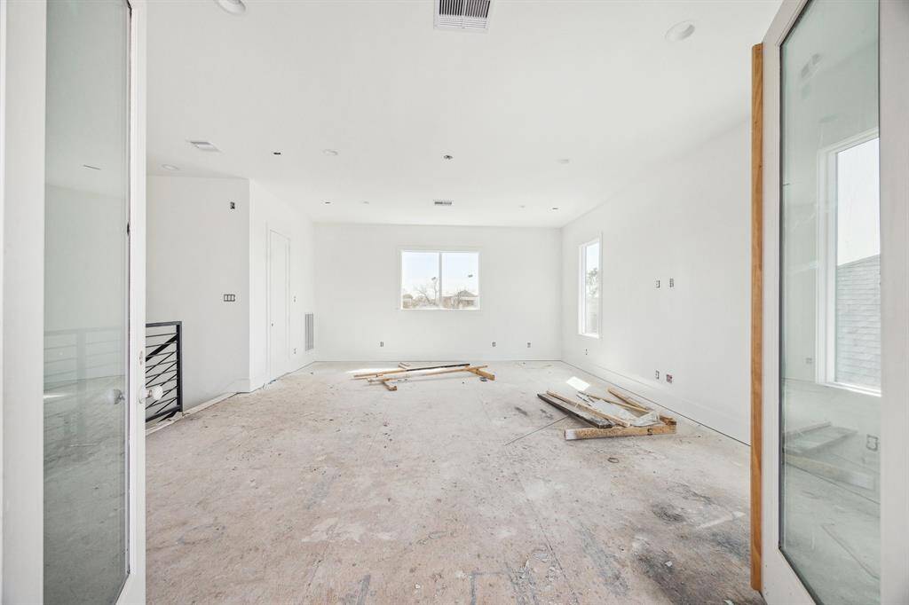 Massive Game Room with a Full Bathroom and access to the Covered Rooftop Terrace.  Construction as of April 18th, 2025.