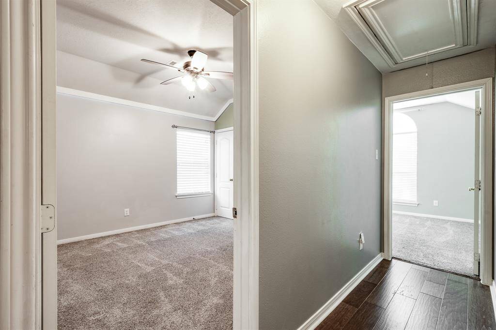 Hallway looking into two other bedrooms