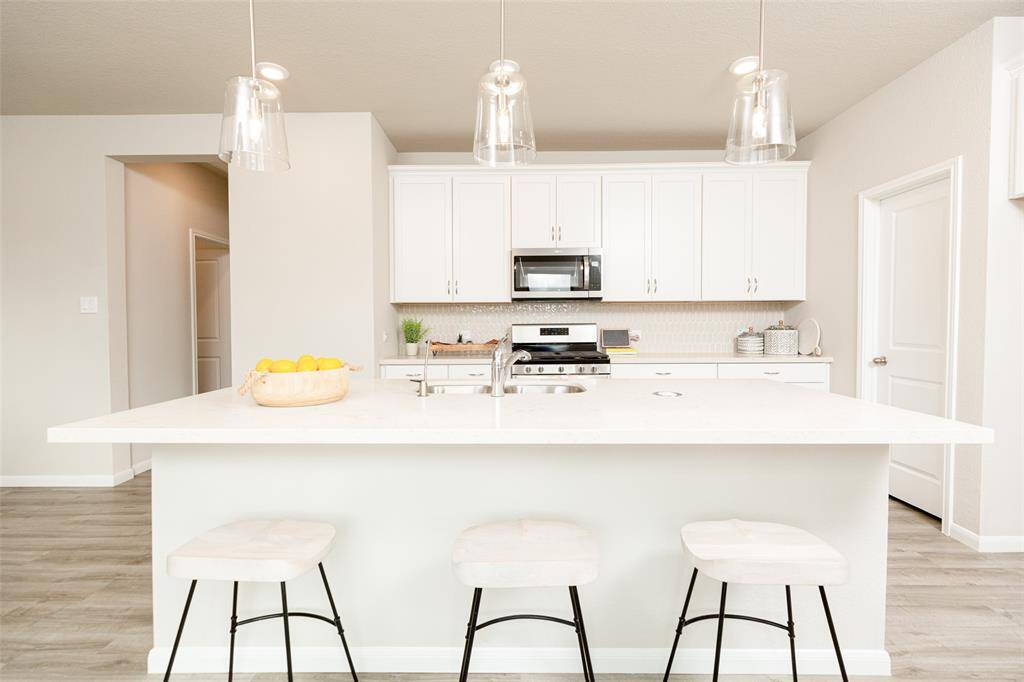 Sample photo of completed home with similar plan. As-built colors and selections may vary.