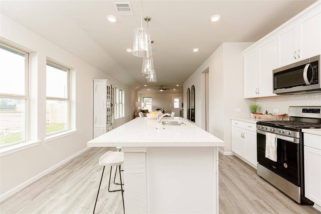 Sample photo of completed home with similar plan. As-built colors and selections may vary.