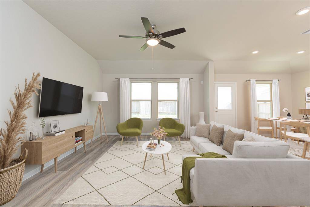 Generously sized secondary bedrooms featuring spacious closets, soft and inviting carpeting underfoot, large windows allowing plenty of natural light, and the added touch of privacy blinds for your personal retreat. Sample photo of completed home with similar floor plan. Actual colors and selections may vary.