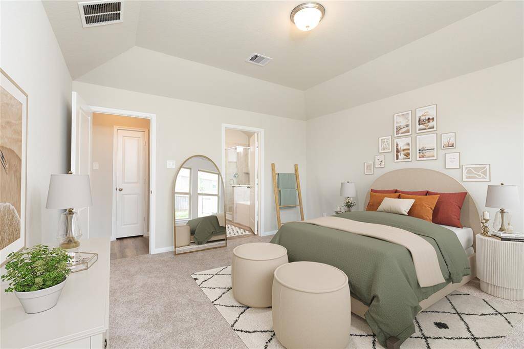 Secondary bath features tile flooring, bath/shower combo with tile surround, light stained wood cabinets, beautiful light countertop. Sample photo of completed home with similar floor plan. Actual colors and selections may vary.
