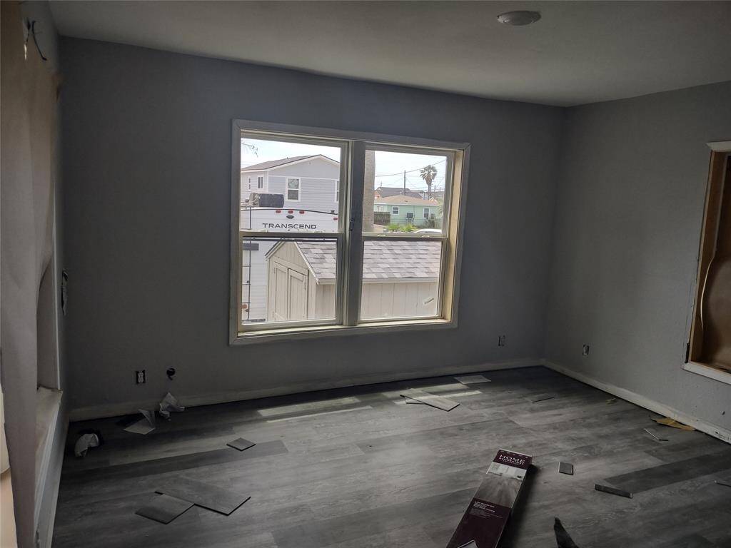 Bedroom has brand new laminate flooring, window, and fresh texture and paint.