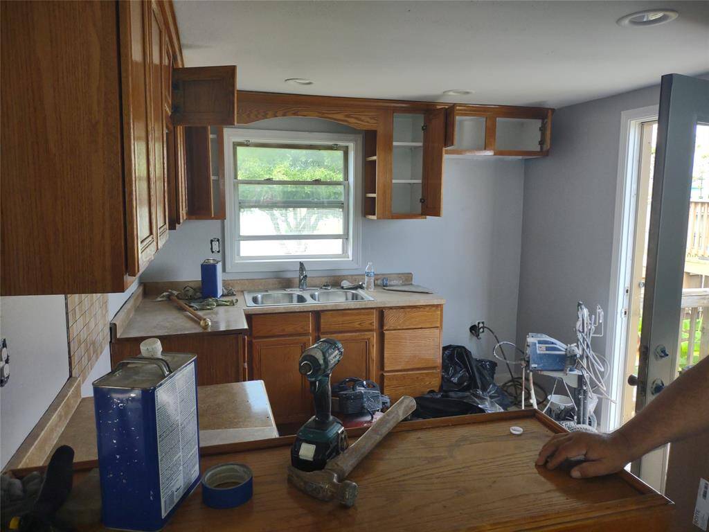 Kitchen is getting quartz countertops, with new refrigerator and sink